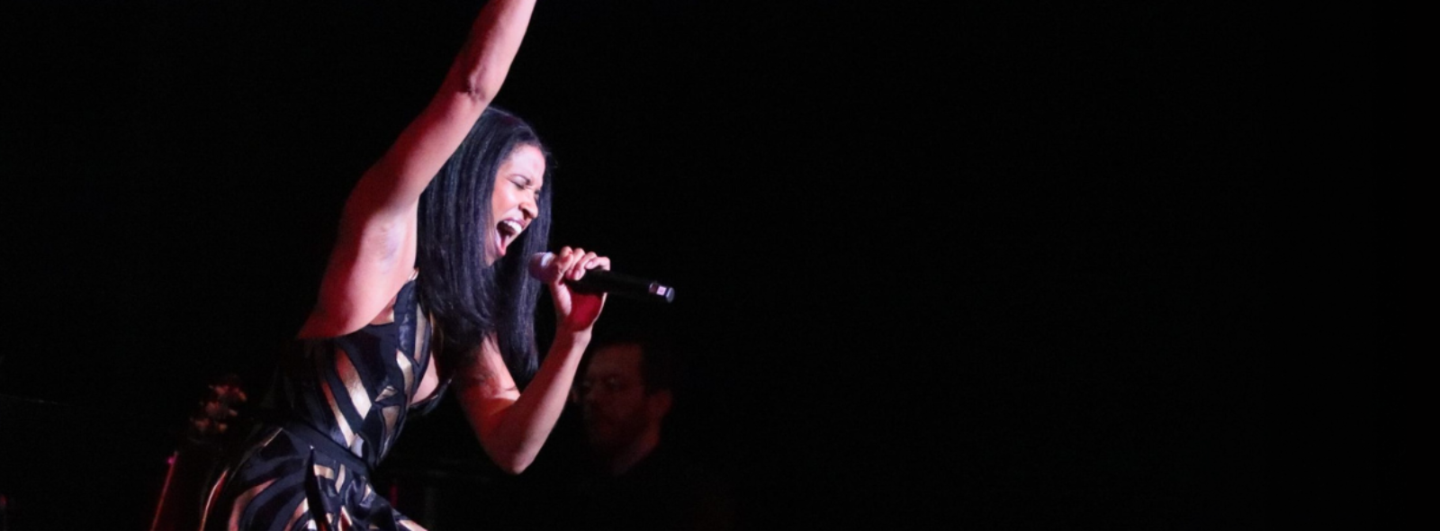 Renee Elise Goldsberry, woman singing
